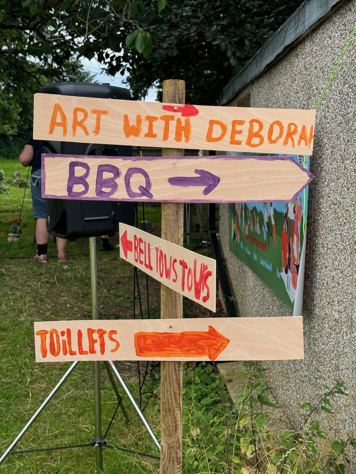 Sign post showing Art with Deborah, BBQ, Tower Tours, Toilets